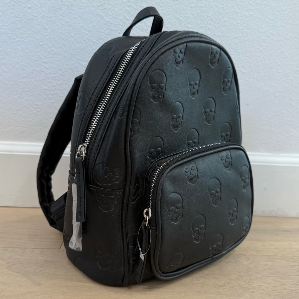 Black Faux Leather Backpack Purse with Embossed Skulls – Edgy Gothic Style Bag